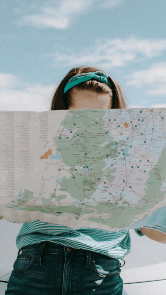 Graphic woman holding map